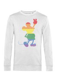Biała bluza z długim rękawem, zdobiona kolorową, abstrakcyjną grafiką postaci z zaokrąglonymi uszami, znakiem pokoju i różnokolorowymi paskami w tęczy.