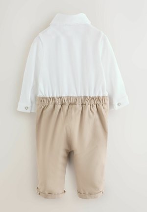 White collared long-sleeve top with textured fabric, paired with beige elastic-waist shorts featuring rolled cuffs.