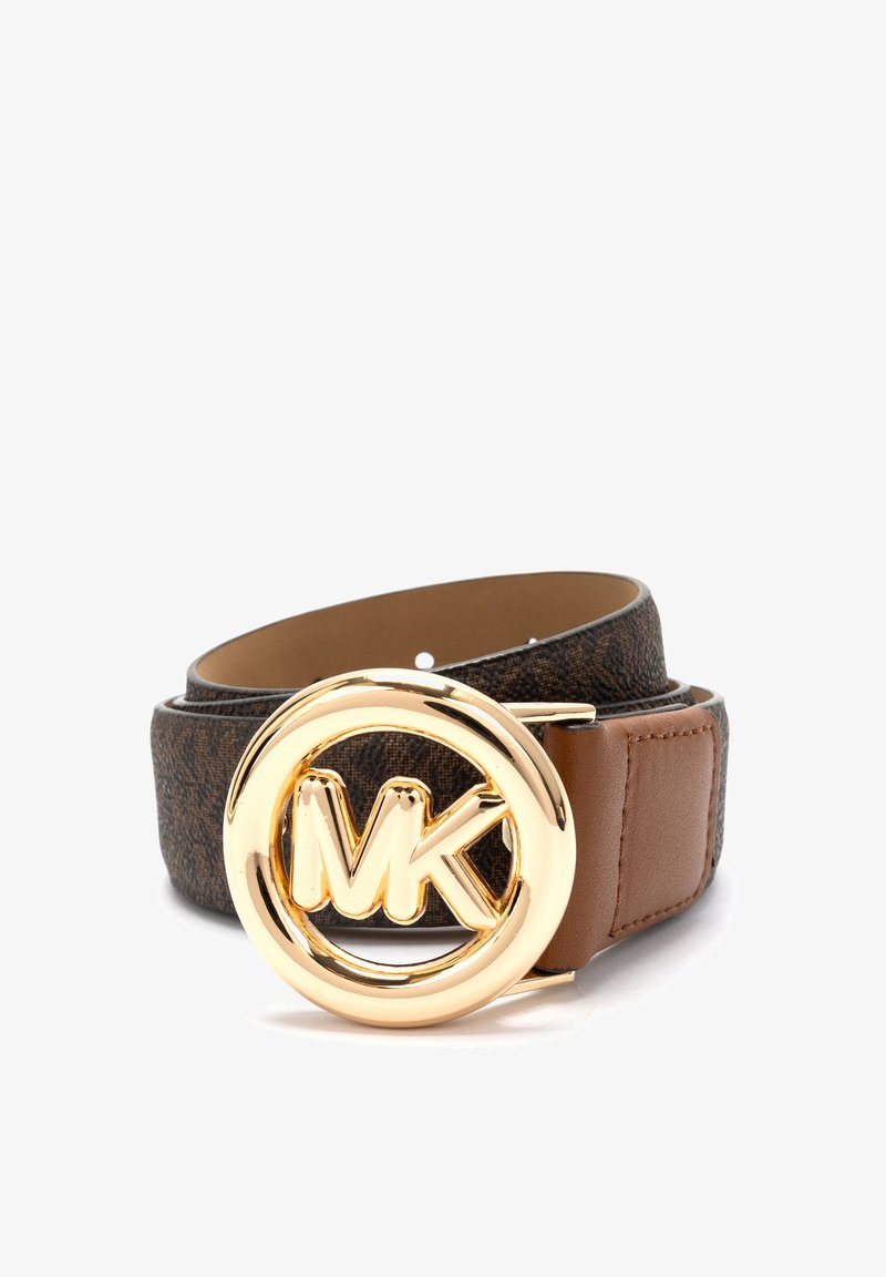 Brown canvas belt with a smooth brown leather loop, featuring a round gold-tone MK logo buckle and a textured pattern on the surface.
