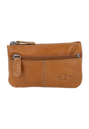Tan leather wallet with a zip closure, featuring contrasting stitching, a small loop, and embossed logo detail on one side. Compact and rectangular shape.
