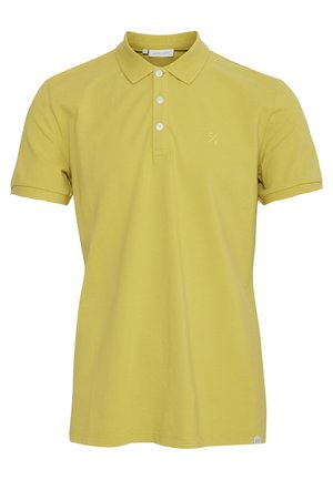 Polo majica kratkih rukava u svijetloj žutoj boji od pamuka. Ima tri gumba na prednjem dijelu i suptilan logotip na prsima. Jednostavan dizajn bez uzoraka.