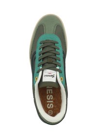 Green and teal sneaker with a suede and textile upper, rounded toe, metal eyelets, and a cork insole marked with "42."