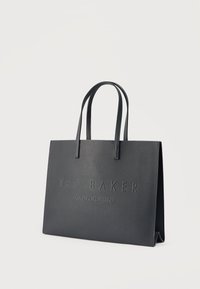 Μαύρη δερμάτινη τσάντα ώμου με ανάγλυφο λογότυπο "TED BAKER LONDON", δομημένο σχήμα, διπλές λαβές και διακριτική υφή.