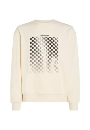 Felpa color crema con un motivo geometrico nero e la scritta "KARL LAGERFELD" nella parte superiore. Maniche e orlo a coste. Tessuto morbido.