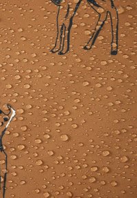 Water-repellent fabric in a light brown shade, featuring embossed black animal designs and a textured surface with water droplets.