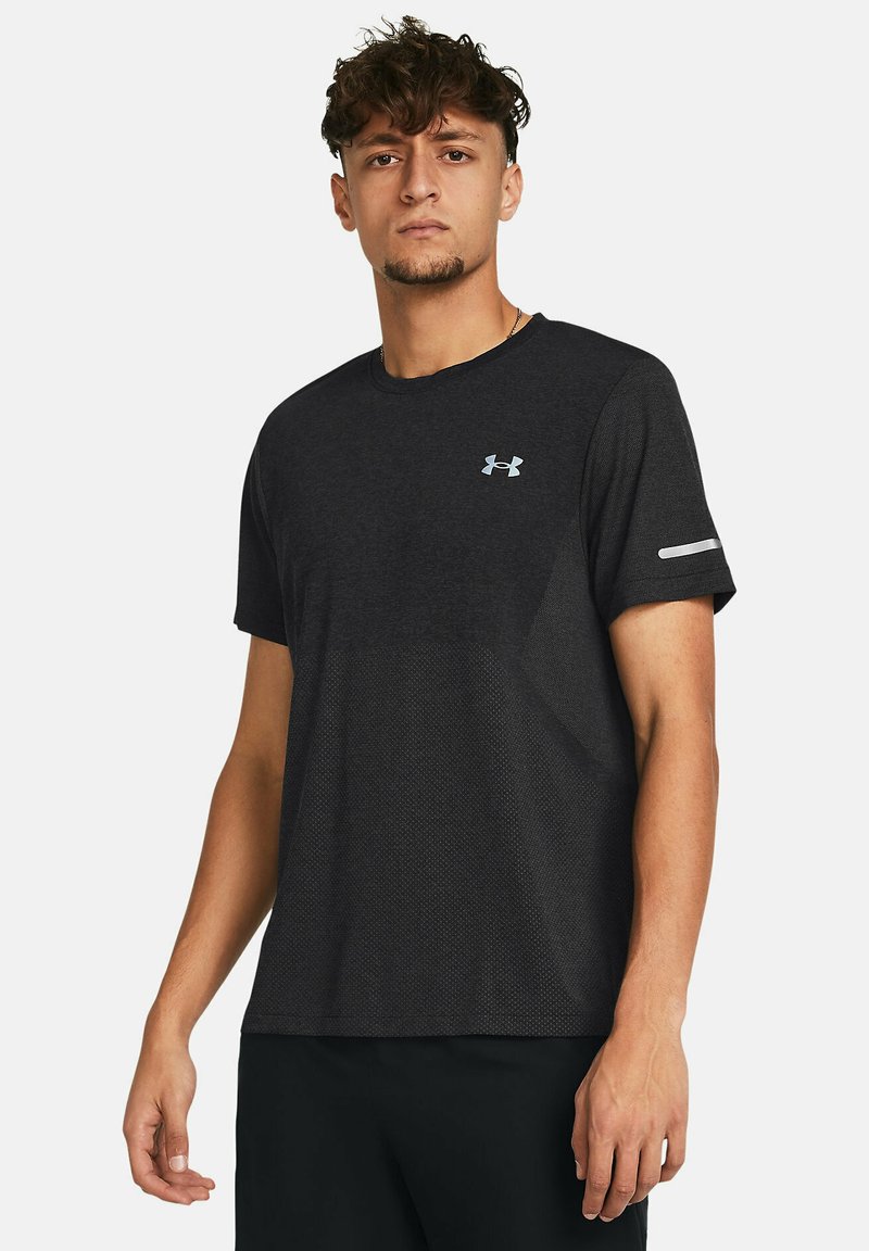 Black athletic t-shirt in breathable material, featuring a subtle textured pattern, short sleeves, and a small light-blue logo on the chest.
