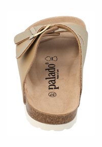 Beige Rutschsandale mit Korksohle, strukturiertem Fußbett und einer Schleifenakzent. Mit weichem Obermaterial und gestempeltem Logo innen.