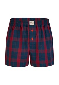 Pantaloni boxer a scacchi rossi e blu, con vita elastica e due bottoni sul davanti. Realizzati in morbido tessuto di cotone.
