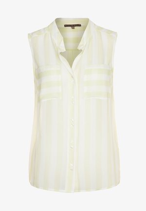 Mouwloze blouse in lichtgeel met witte strepen. Heeft een knoopsluiting aan de voorkant, twee borstzakken en een zachte, lichte stof.