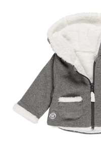 Grå zip-up hoodie med vit fuskpälsfodring, krage och manschetter; har en framficka och en logotyp-patch på den nedre sidan.
