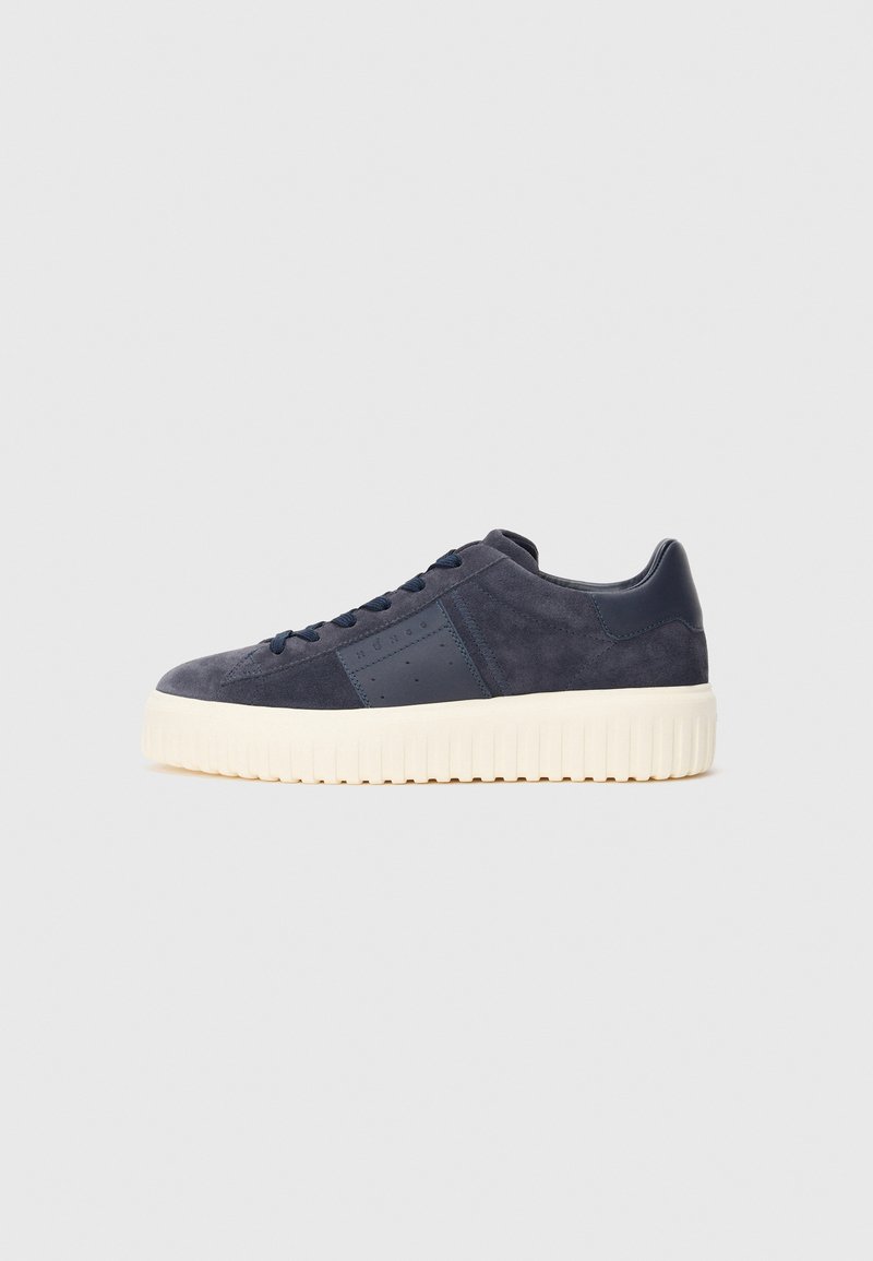 Navy blue suede sneaker with tonal laces, leather panel detailing, and thick off-white ridged sole.