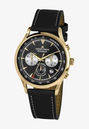Gouden en zwarte chronograafhorloge met een soepel zwart leren band, voorzien van zilveren subdials, een tachymeter en dunne uuraanduiders.