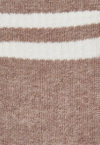 Knitted fabric in a warm brown tone with alternating white stripes. Features a soft texture and a horizontal ribbed design.
