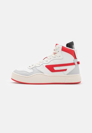 High-top sneaker in white leather with red and gray accents. Features a cushioned sole, rounded toe, and prominent logo detail on the side.