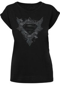 Black cotton t-shirt featuring a gray graphic design with a Superman shield, wings, and the text "My Father, My Hero." Rolled sleeves.