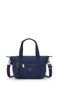 Navy blue nylon handbag with dual handles, adjustable strap, front zip pocket, round logo patch, and a small charm accent.