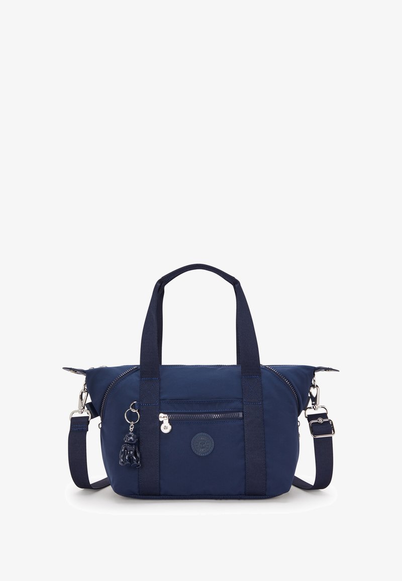 Granatowa torebka nylonowa z podwójnymi uchwytami, regulowanym paskiem, przednią kieszenią na zamek, okrągłą łatą z logo oraz małym akcentem w postaci zawieszki.