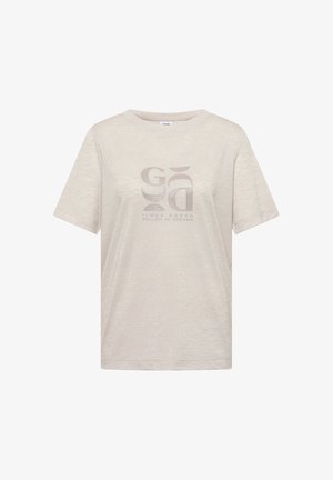 Beżowy t-shirt z krótkim rękawem, okrągłym dekoltem i abstrakcyjnym wzorem graficznym na środku, z napisem „Times Ahead Follow Your Dreams.”