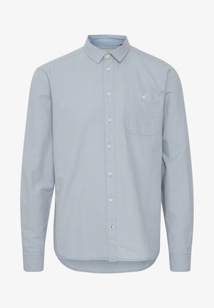 Vaaleansininen pitkähihainen nappipaita, puuvillamateriaalia, kauluksessa yksi rintatasku, pyöristetty helma, hienovarainen rakenne.