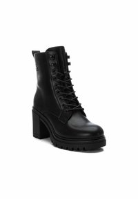 XTI Botines con plataforma - black