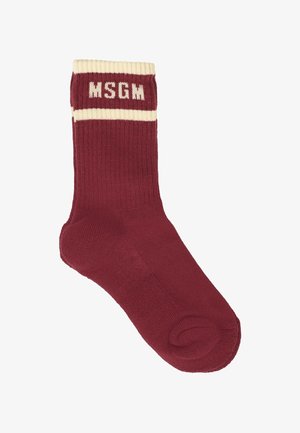 Calzino di cotone borgogna con bordo a coste e fascia crema; presenta il logo "MSGM" in bianco sulla fascia; texture liscia e forma standard del calzino.