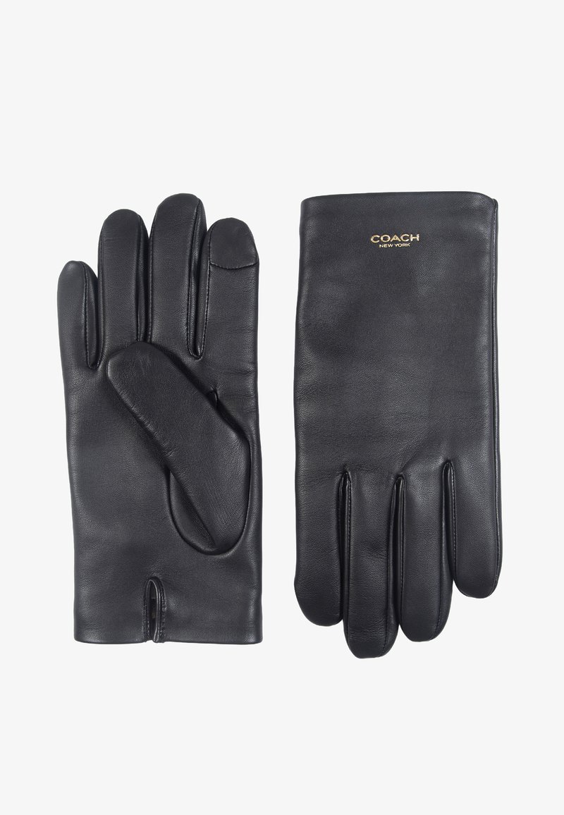 Svarta läderhandskar med en slät yta, som har fem fingrar och en separat tumme, märkta med "COACH" i guld vid handleden.