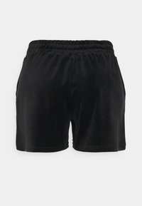 Black velvet shorts with an elastic waistband, featuring a smooth texture and a simple design, cut above the knee with no visible hardware.