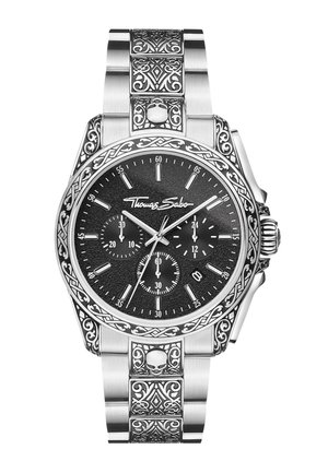 Orologio da polso argento con quadrante nero, tre sottoquadranti, incisioni decorative e motivi di teschio sul bracciale in metallo e intorno alla lunetta.