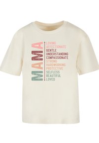 Cream cotton t-shirt featuring the word "MAMA" in large, colorful text with positive adjectives surrounding it in varying shades and fonts.