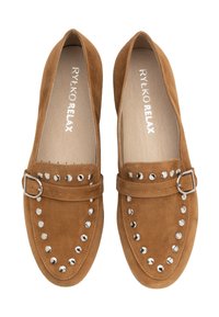 Brown suede slip-on shoes with a rounded toe, silver studs along the front, and a side buckle detail. Soft texture and flat sole.