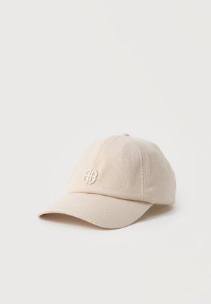 Beige fabric baseball cap with curved brim and small embroidered "AB" logo on front, displayed on a plain white background.