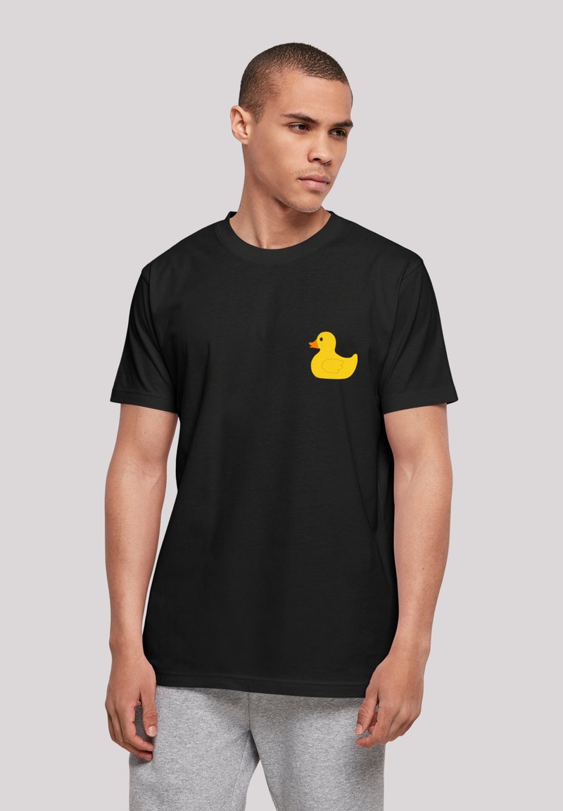 Black cotton t-shirt featuring a yellow rubber duck graphic on the left chest area. Short sleeves and crew neckline.