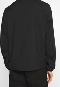 Tommy Hilfiger Giacca leggera - black
