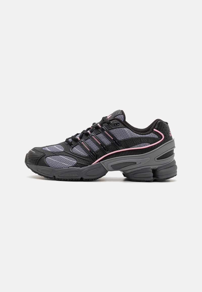 Black and gray athletic shoes with mesh panels, pink accent lines, and a chunky sole design. Features laces and textured material details.