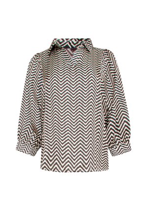 Patterned blouse featuring a zigzag design in black, white, and teal, with a slightly loose fit and a collarless neckline.