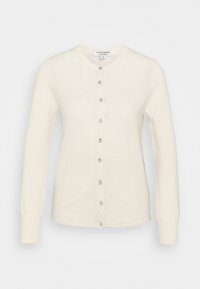 Krémový kardigan s kulatým výstřihem, dlouhými rukávy a zapínáním na knoflíky vpředu. Má perleťové knoflíky a měkkou, texturovanou látku.