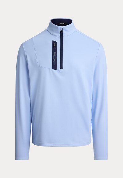 Ανοιχτό μπλε πουλόβερ με γιακά μισής φερμουάρ, μακριά μανίκια και τσέπη με φερμουάρ που έχει ναυτικό μπλε λεπτομέρεια. Λείο, ελαφρύ ύφασμα.