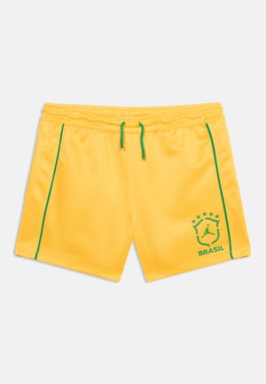 Rumeno športne hlače z zelenim vezalko in obrobo, na desni nogi z zelenim emblemom Brazilije s petimi zvezdami.