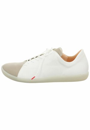 White leather shoes with a beige suede toe cap, lace-up design, smooth texture, and a translucent rubber sole with a red accent.
