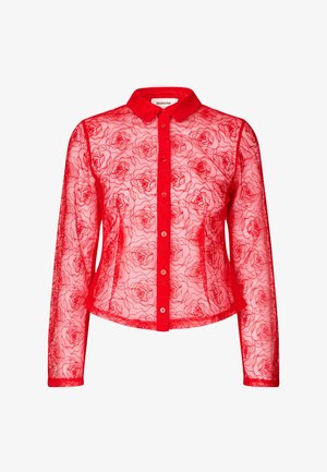 Punane poolläbipaistev nööpidega särk pikkade varrukatega, millel on lilleline pitsmuster. Kraedega disain, sirge äär ja ees olevad numbrid.