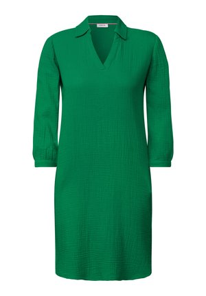 Zelené šaty ke kolenům vyrobené z texturované látky. Mají výstřih do V, dlouhé rukávy s manžetami a límeček. Jednoduchý design, jednofarebné.