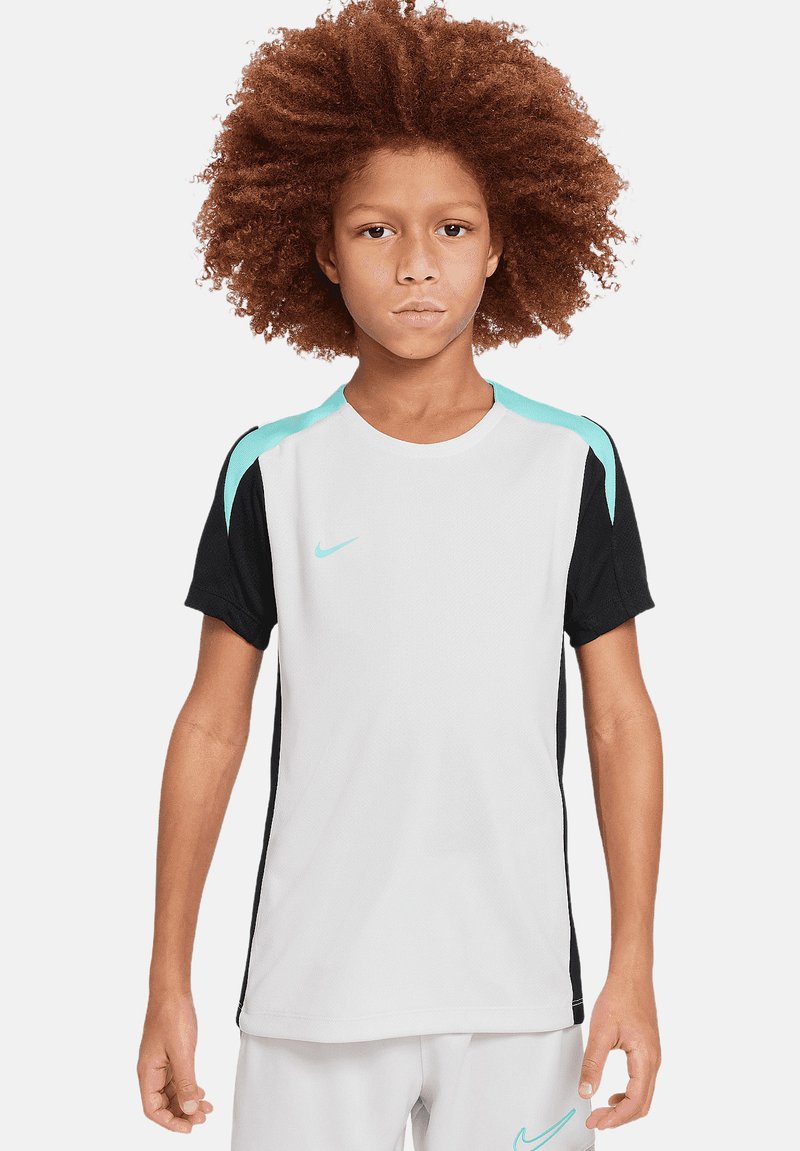 Maglietta sportiva bianca e nera con dettagli turchesi, maniche corte, collo giro e logo Nike sul petto.
