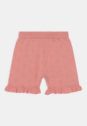 Calções de algodão cor-de-rosa com bainha volumosa, apresentando um padrão texturizado de pequenos pontos elevados. Cintura macia e elástica.
