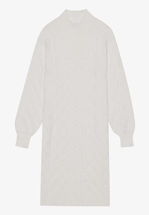 White cable-knit sweater dress with a high collar, balloon sleeves, and a ribbed hem, featuring a textured pattern throughout.