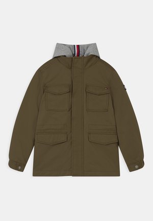 Olive green jacket with a gray hood, featuring four pockets, button closures, and a smooth texture. Interior hood has red and blue stripes.
