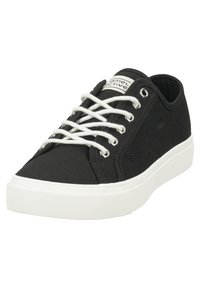 Schwarze Leinenschuhe mit weißer Gummisohle, runder Zehenpartie und weißen Schnürsenkeln. Verfügt über ein Logo-Tag an der Zunge und metallische Ösen für die Schnürsenkel.