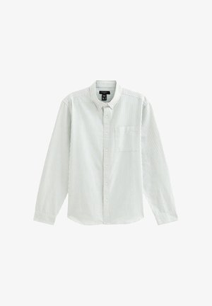 Lichtgroen en witte gestreepte blouse met lange mouwen, kraag, knopen aan de voorkant en een borstzak. Katoenen stof, normale pasvorm.