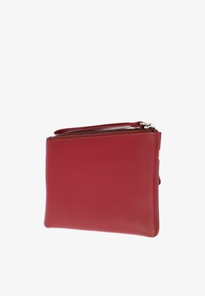 Red leather clutch bag with zipper closure and wrist strap on white background.