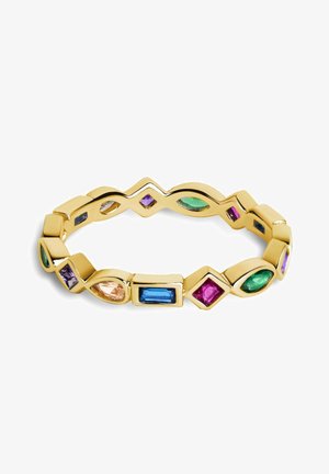 Bague en ton or ornée de pierres précieuses multicolores de différentes formes, y compris ovales et rectangulaires, intégrées dans un design ondulé.