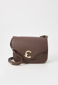 Brown leather shoulder bag with a textured finish, gold accent clasp, and adjustable strap. Features a flap closure and curved edges.